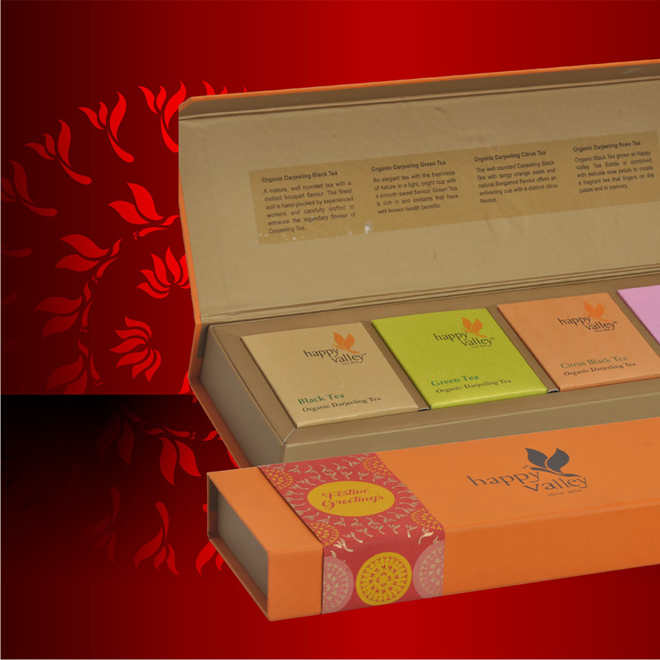 https://www.wysiwyg.co.in/sites/default/files/worksThumb/Ambootia-happy-valley-tea-packaging-box-festive-durga-puja-2017.jpg